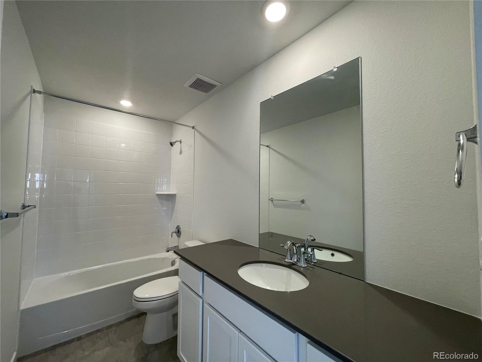 755 Yankee Boy Loop Elizabeth, CO 80107 - Photo 20 of 31 a bathroom with a toilet a sink and bathtub