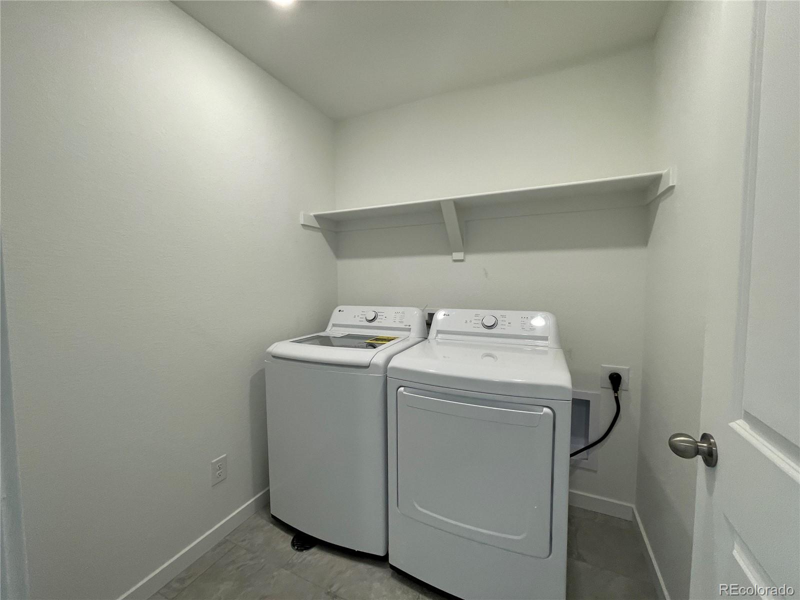 755 Yankee Boy Loop Elizabeth, CO 80107 - Photo 21 of 31 a utility room with dryer and washer