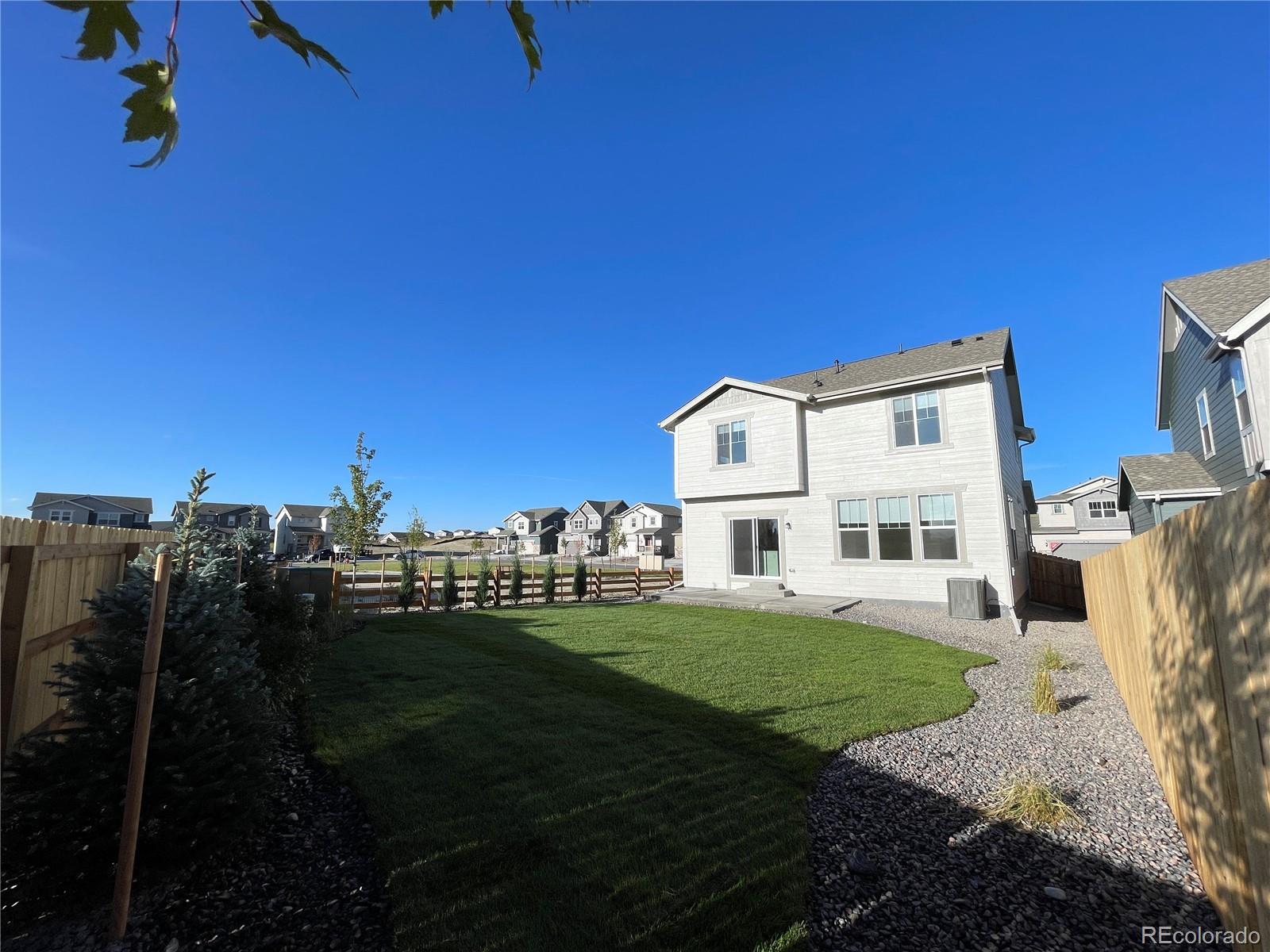 755 Yankee Boy Loop Elizabeth, CO 80107 - Photo 29 of 31 a view of a house with backyard and sitting area