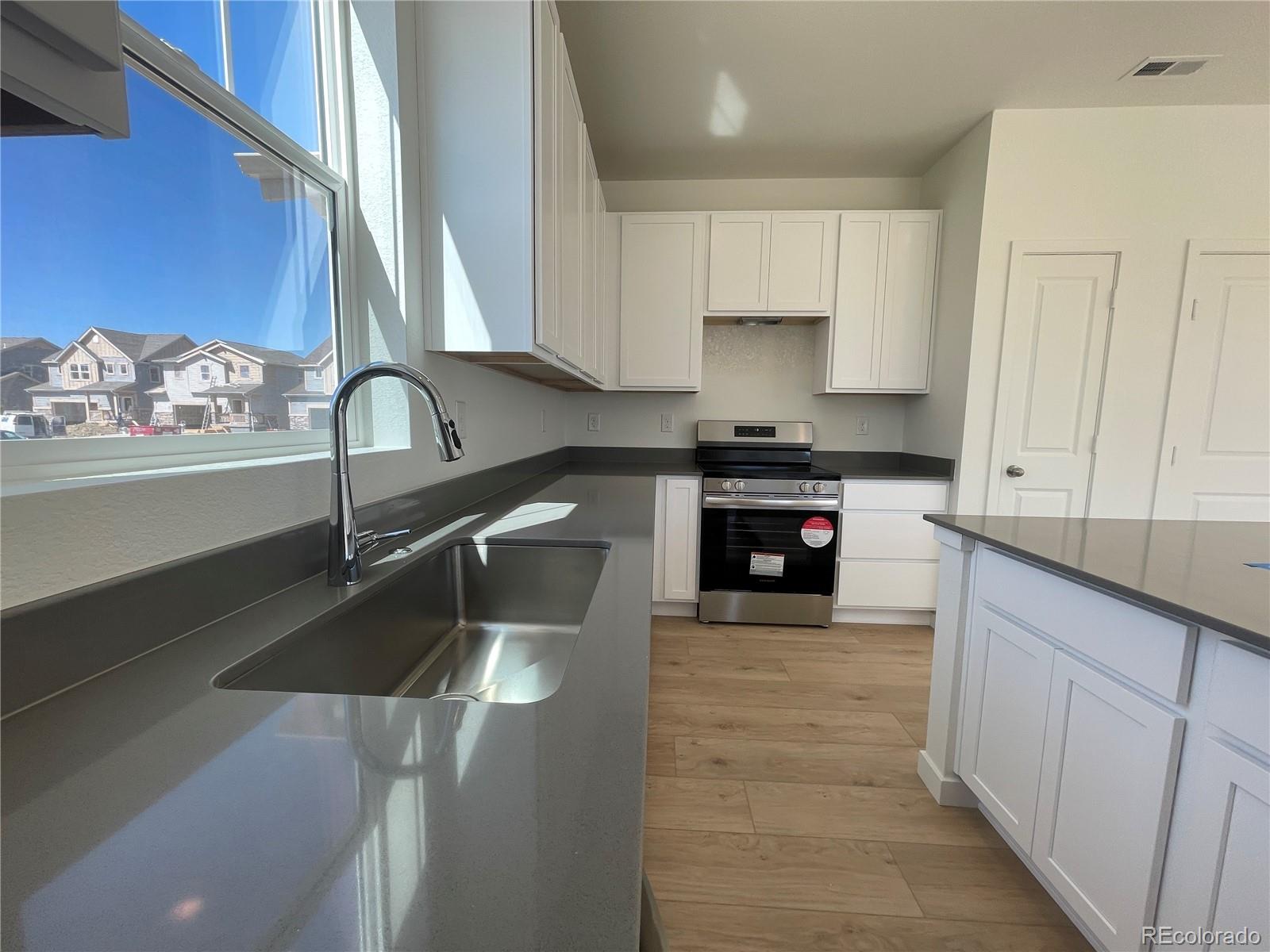 755 Yankee Boy Loop Elizabeth, CO 80107 - Photo 4 of 31 a kitchen with a sink and cabinets