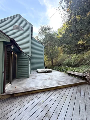 a view of a wooden floor on the roof deck