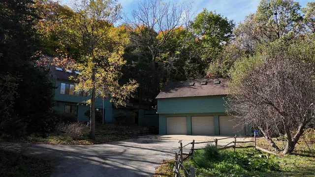 a view of house with yard