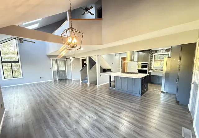a view of kitchen and dining room with wooden floor
