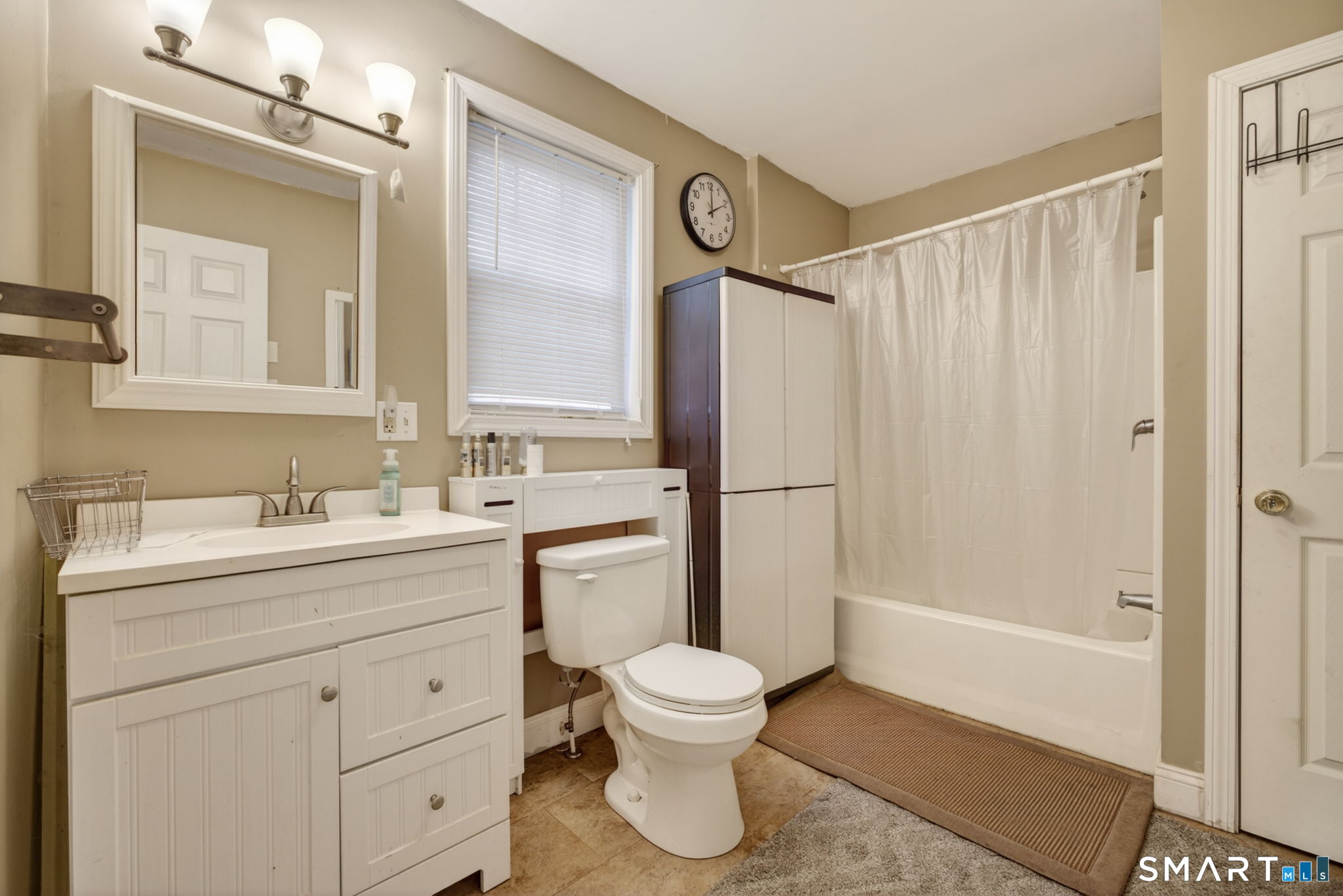 670 Hanover Road Meriden, CT 06451 - Photo 11 of 40 a bathroom with a shower sink vanity mirror and toilet