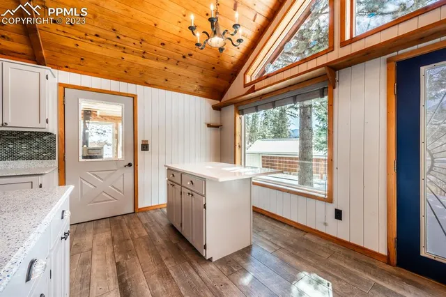 a kitchen with stainless steel appliances a refrigerator and stove