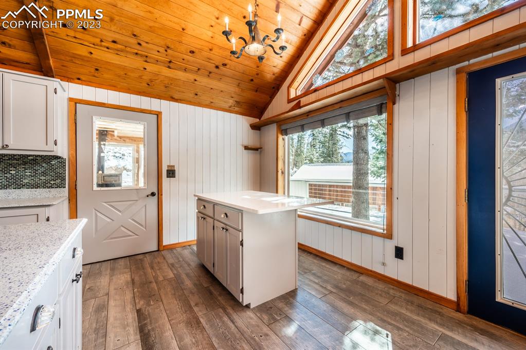 38 Wetmore Drive Rye, CO 81069 - Photo 11 of 49 a kitchen with stainless steel appliances granite countertop a stove and wooden cabinets with a large window