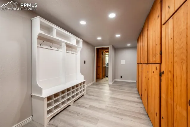 a view of a room with wooden floor