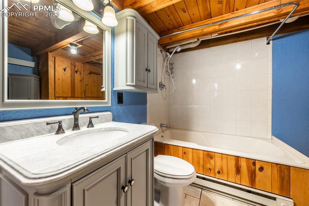 38 Wetmore Drive Rye, CO 81069 - Photo 35 of 49 a bathroom with a sink a toilet a mirror and bathtub