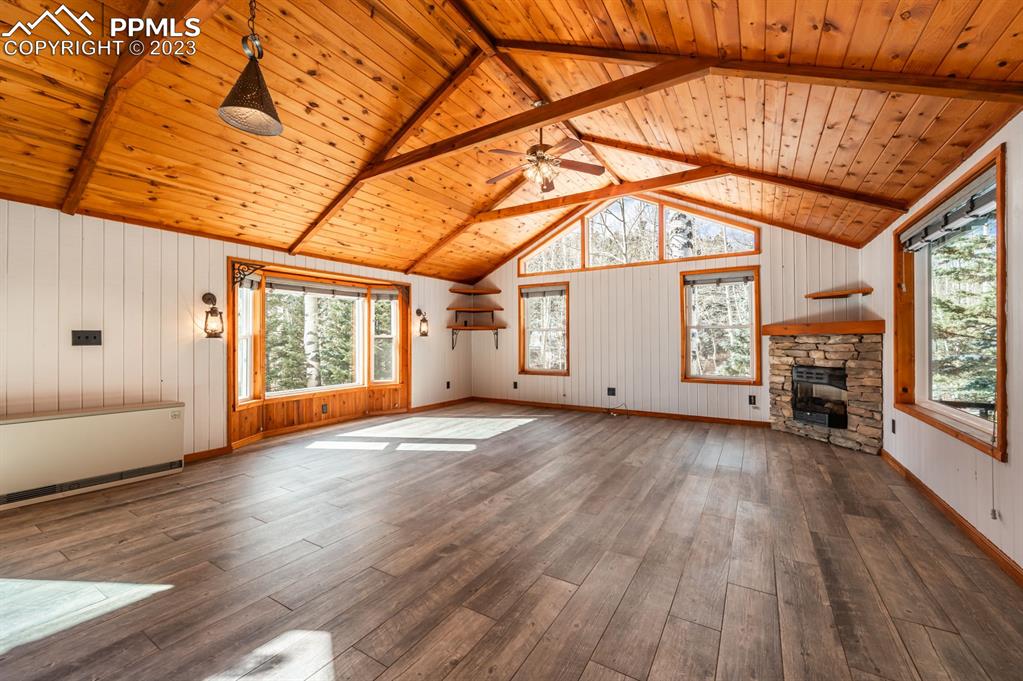 38 Wetmore Drive Rye, CO 81069 - Photo 7 of 49 an empty room with wooden floor and windows