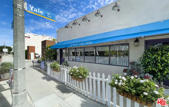 a front view of a house with a large window