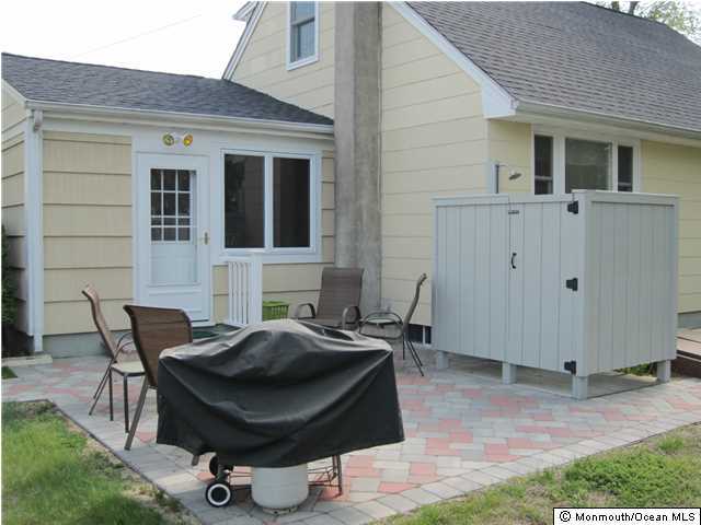 2107 Wilson Road Point Pleasant, NJ 08742 - Photo 3 of 3 a view of a backyard with table and chairs