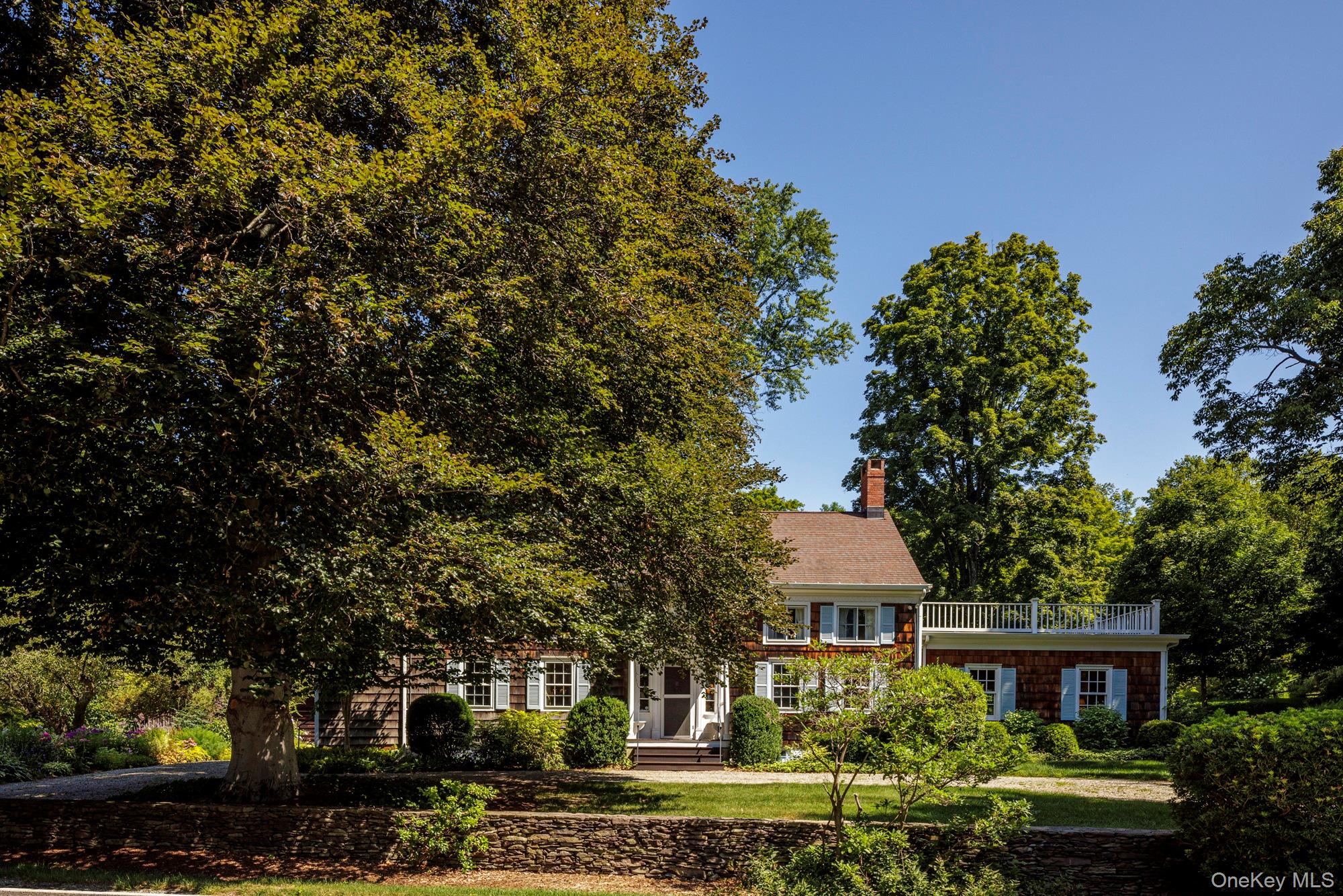 425 Camby Road Millbrook, NY 12545 - Photo 1 of 39 a front view of a house with a garden