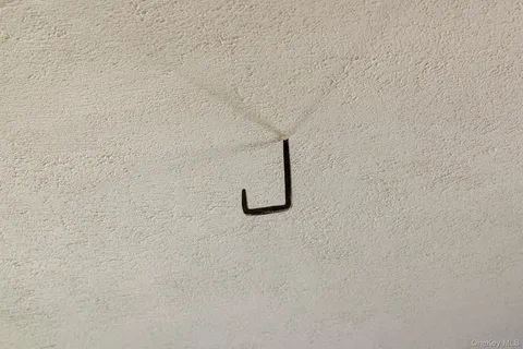 a kitchen with sink refrigerator and large window