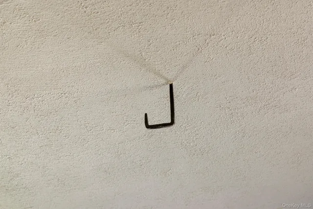 a kitchen with sink refrigerator and large window