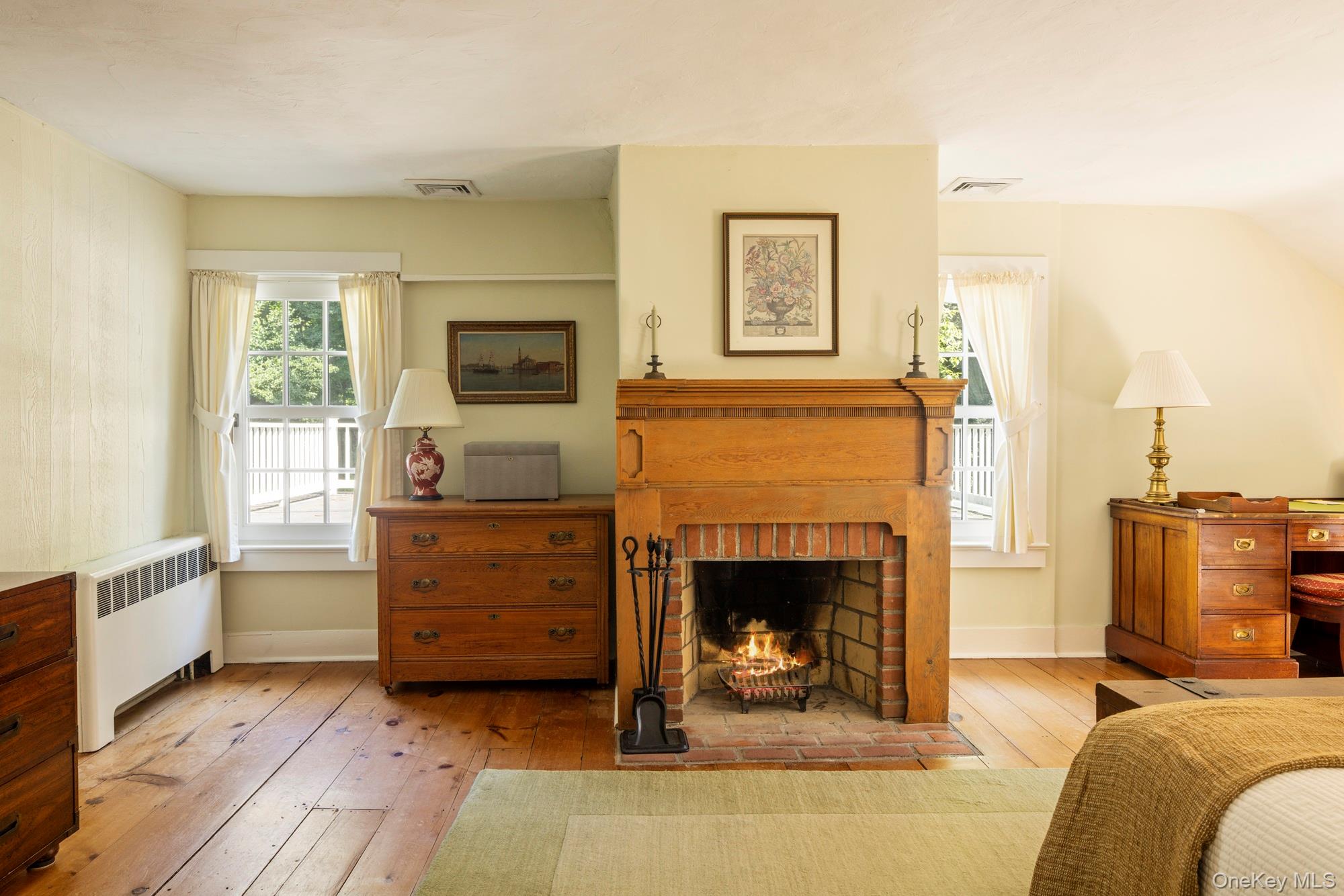 425 Camby Road Millbrook, NY 12545 - Photo 24 of 39 a living room with furniture and a fireplace
