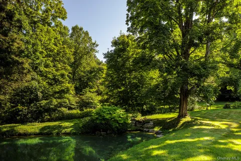 a view of yard with swimming pool
