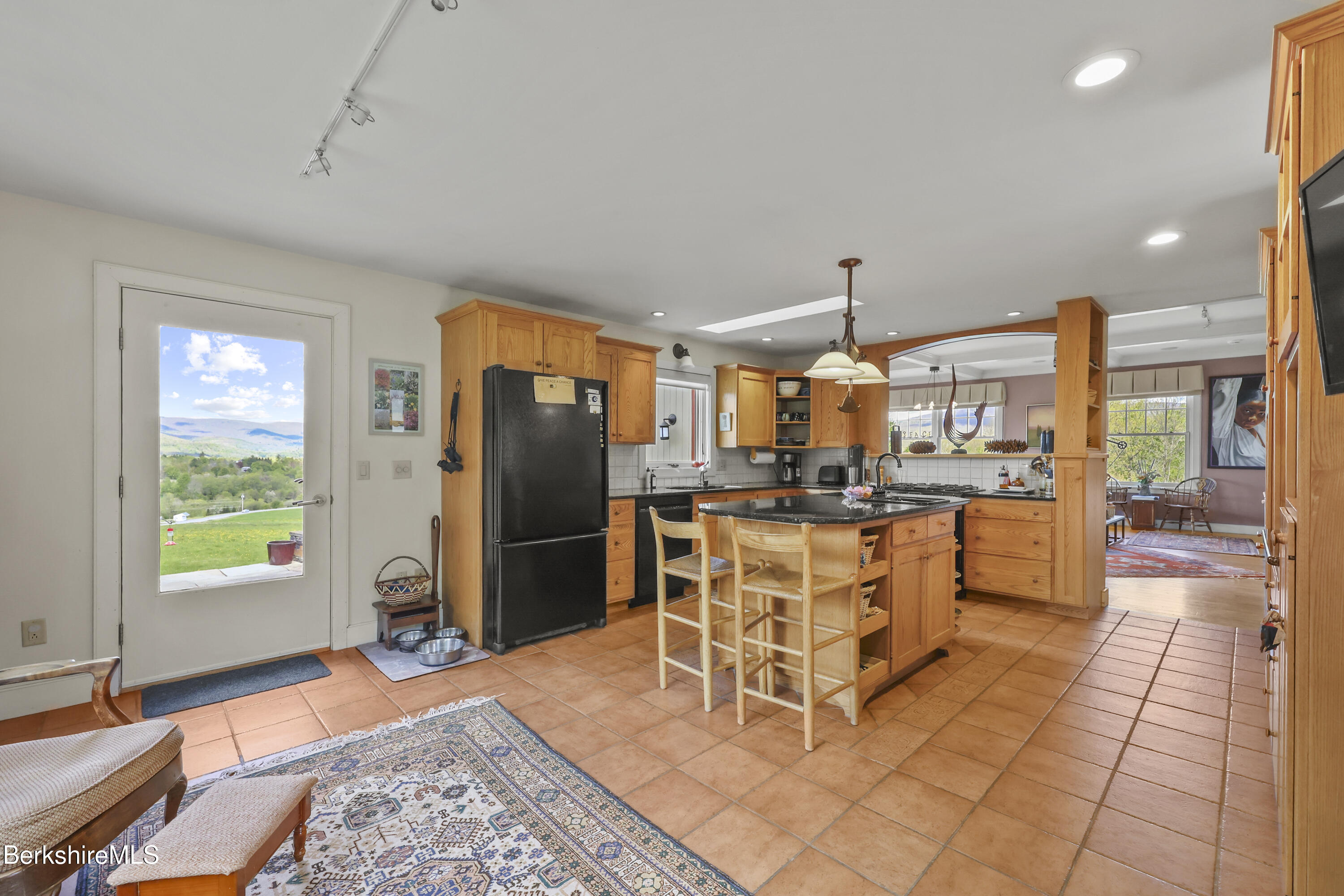 821 Pattison Road North Adams, MA 01247 - Photo 22 of 68 a kitchen with stainless steel appliances granite countertop a refrigerator a sink dishwasher a stove and a dining table with the kitchen view
