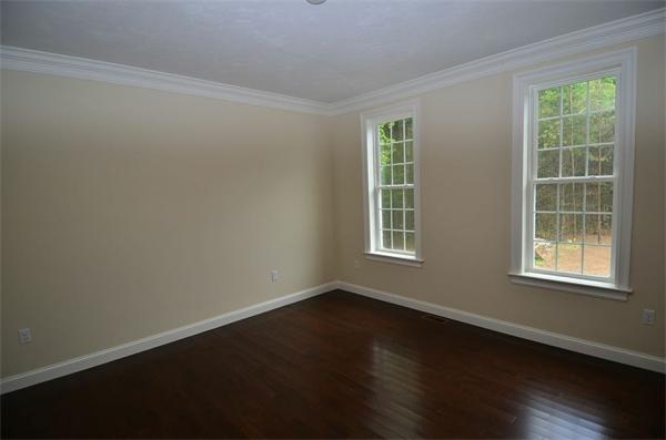 Lot 3 Harvard Road Bolton, MA 01740 - Photo 15 of 23 a view of an empty room with wooden floor and a window