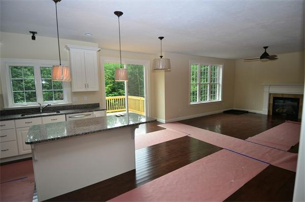 Lot 3 Harvard Road Bolton, MA 01740 - Photo 3 of 23 a kitchen with stainless steel appliances granite countertop a stove a sink and a wooden floors