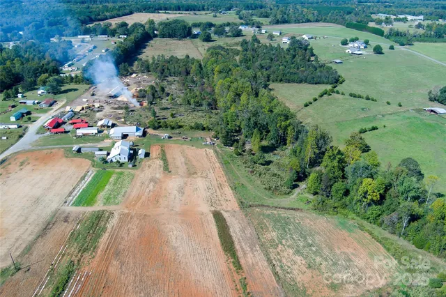 a view of a house with backyard porch and sitting area