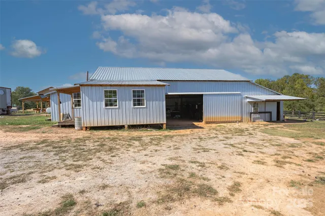 an aerial view of a house with a garden