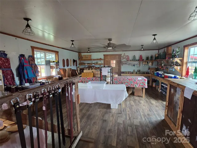 a living room with lots of furniture and a flat screen tv