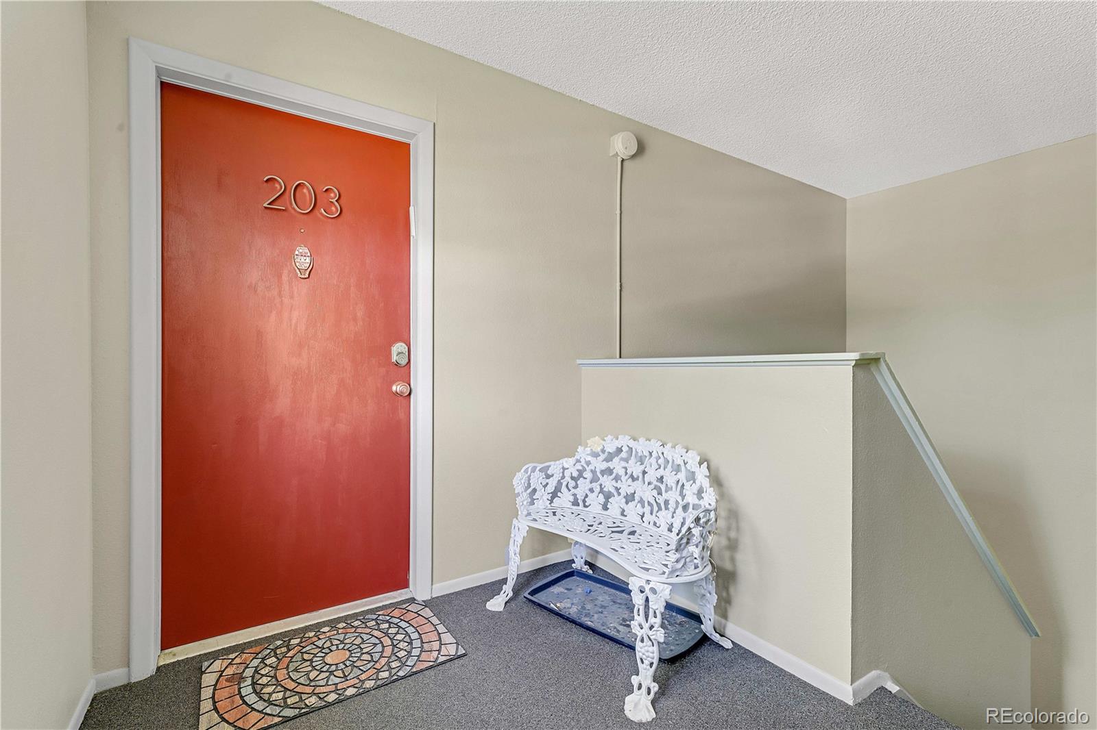3855 South Monaco Street, Unit 203 Denver, CO 80237 - Photo 18 of 26 a room with furniture and a window