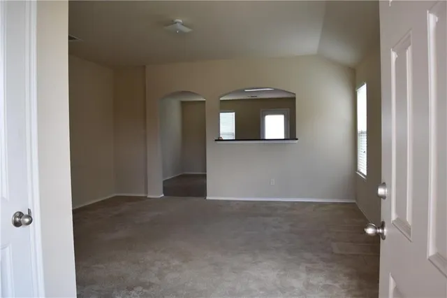 a view of an empty room with mirror