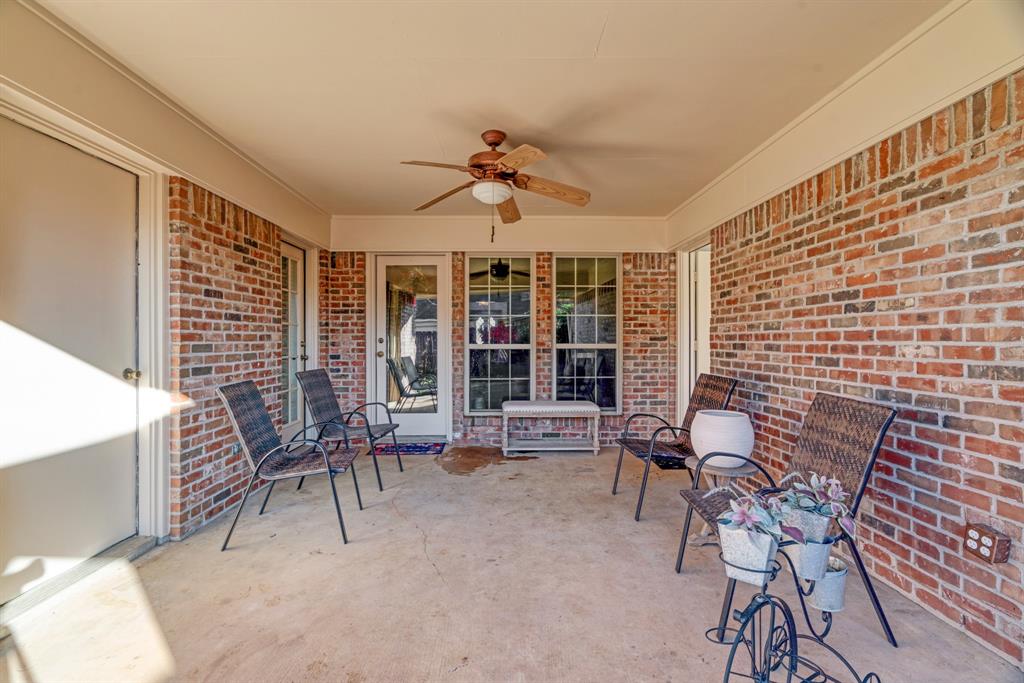 925 Medalist Street Paris, TX 75460 - Photo 21 of 24 a dining room with furniture and a window