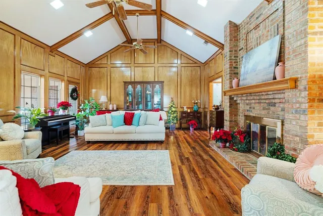 a living room with furniture fireplace and potted plant