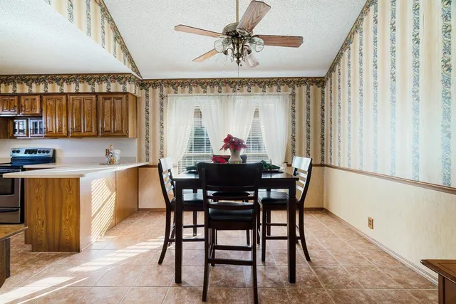 a view of a dining room with furniture and window