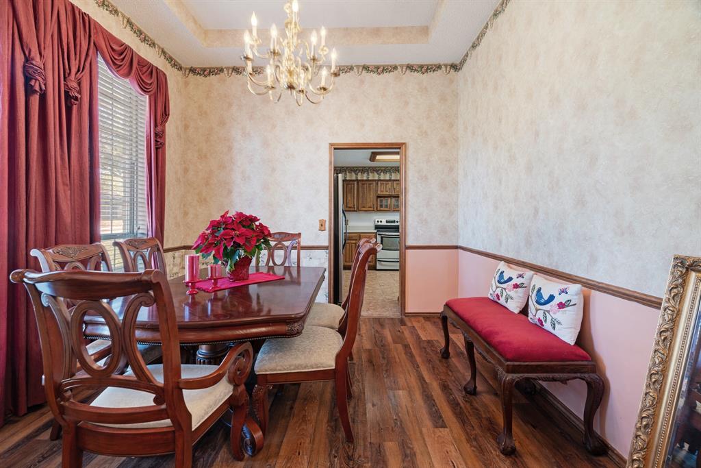 925 Medalist Street Paris, TX 75460 - Photo 10 of 24 a dining room with furniture and window