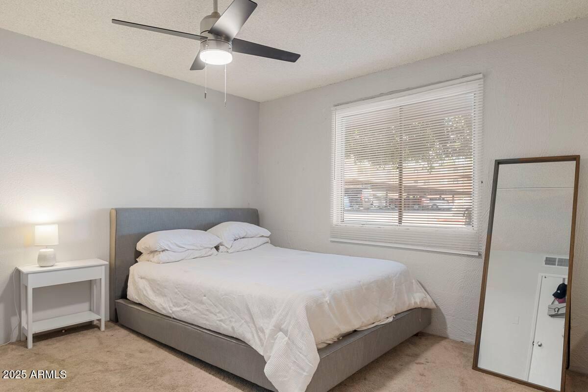 7625 East Camelback Road, Unit B151 Scottsdale, AZ 85251 - Photo 14 of 16 a bedroom with a bed and a window