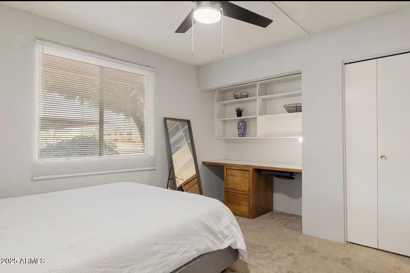 7625 East Camelback Road, Unit B151 Scottsdale, AZ 85251 - Photo 15 of 16 a bedroom with a bed and a window