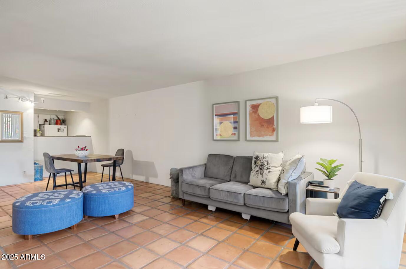 7625 East Camelback Road, Unit B151 Scottsdale, AZ 85251 - Photo 3 of 16 a living room with furniture and a couch