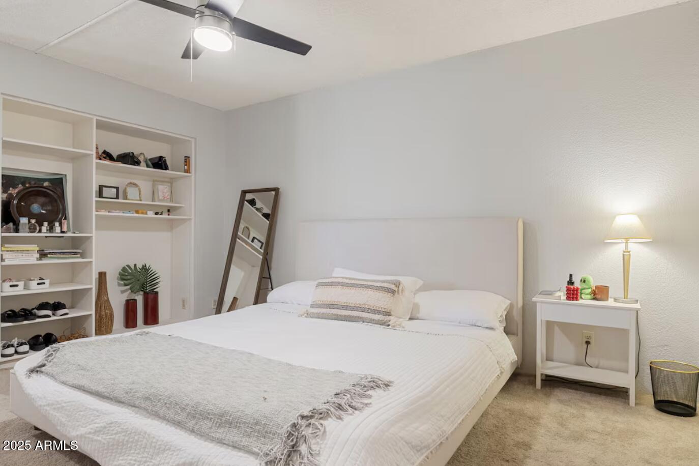 7625 East Camelback Road, Unit B151 Scottsdale, AZ 85251 - Photo 10 of 16 a bedroom with a bed and a tv