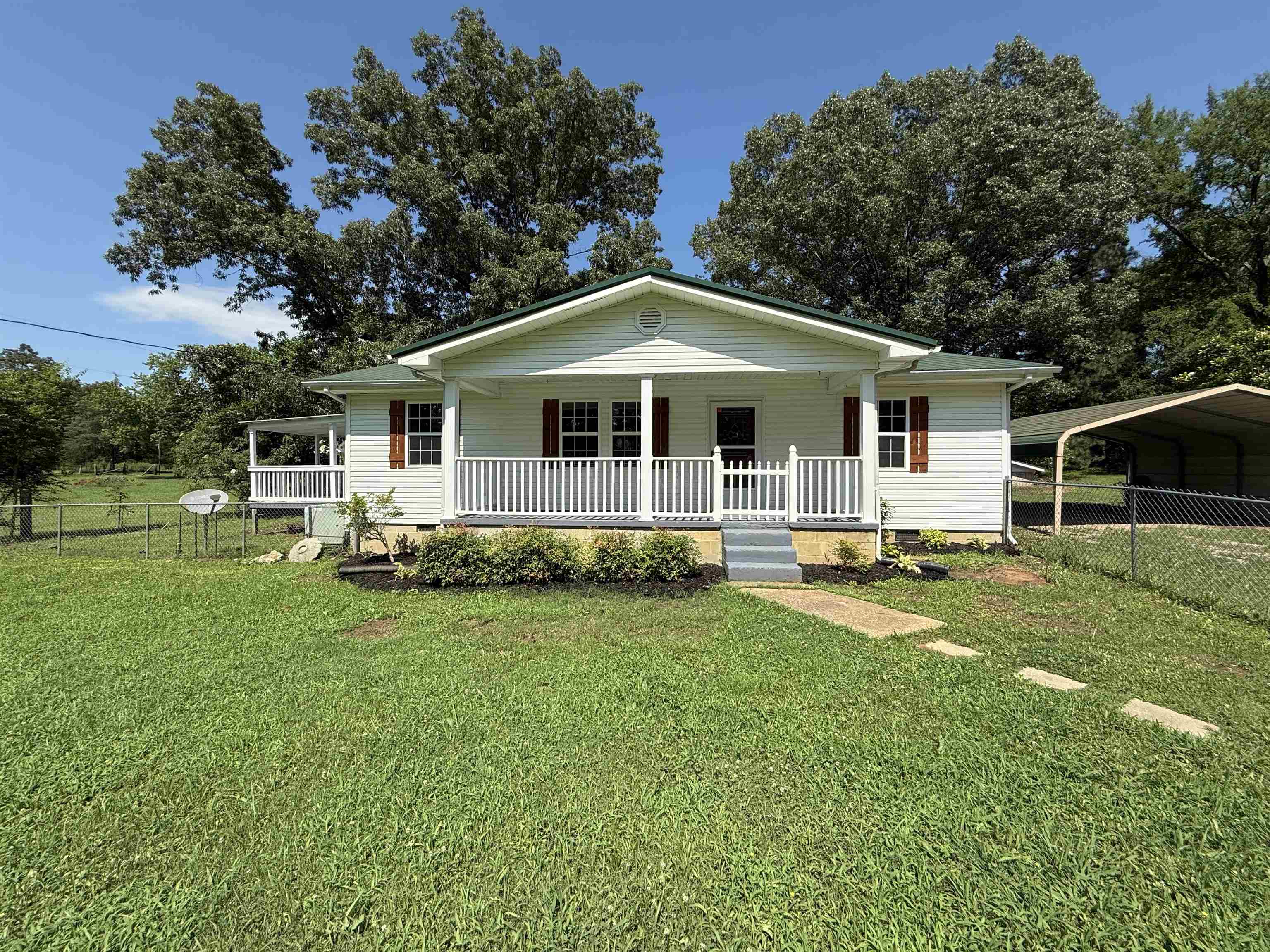 1390 Caney Branch Road Adamsville, TN 38310 - Photo 1 of 37 View of front of house with a porch, a carport, and crawl space