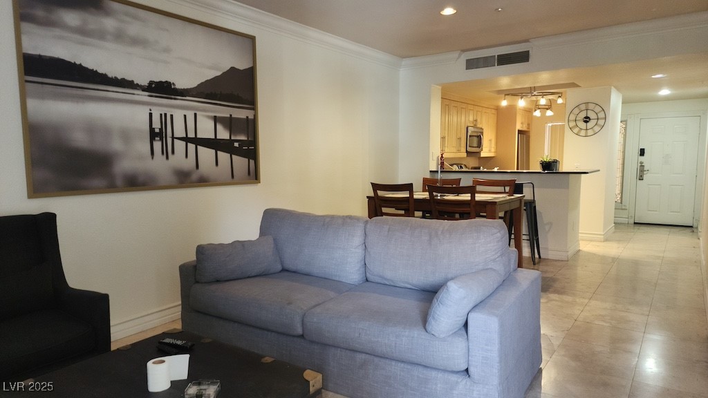 270 East Flamingo Road, Unit 133 Las Vegas, NV 89169 - Photo 12 of 13 Living room featuring ornamental molding, a chandelier, and recessed lighting