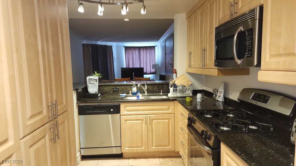 270 East Flamingo Road, Unit 133 Las Vegas, NV 89169 - Photo 3 of 13 Kitchen featuring appliances with stainless steel finishes, light tile patterned floors, dark stone counters, and light brown cabinetry