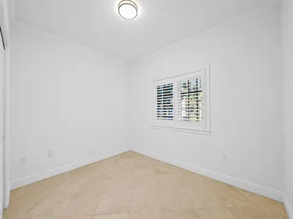 a large kitchen with stainless steel appliances granite countertop a stove a sink and a refrigerator