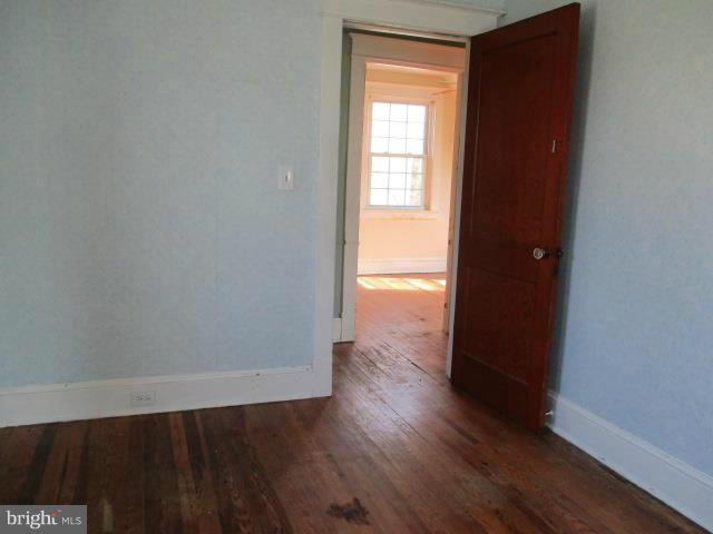 39 Township Road Baltimore, MD 21222 - Photo 11 of 24 an empty room with wooden floor and closet