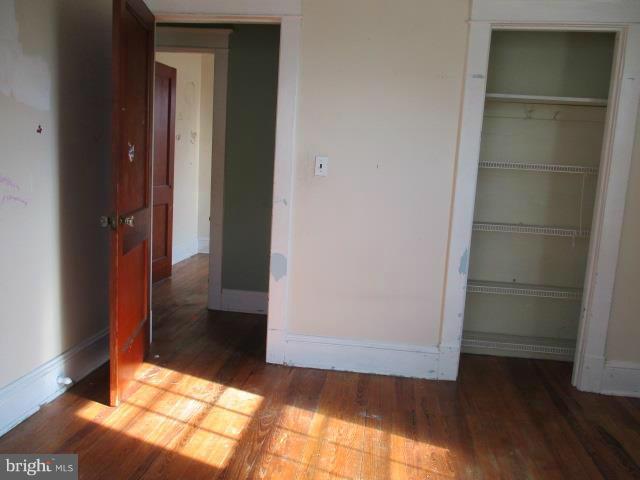 39 Township Road Baltimore, MD 21222 - Photo 17 of 24 an empty room with wooden floor and entrance