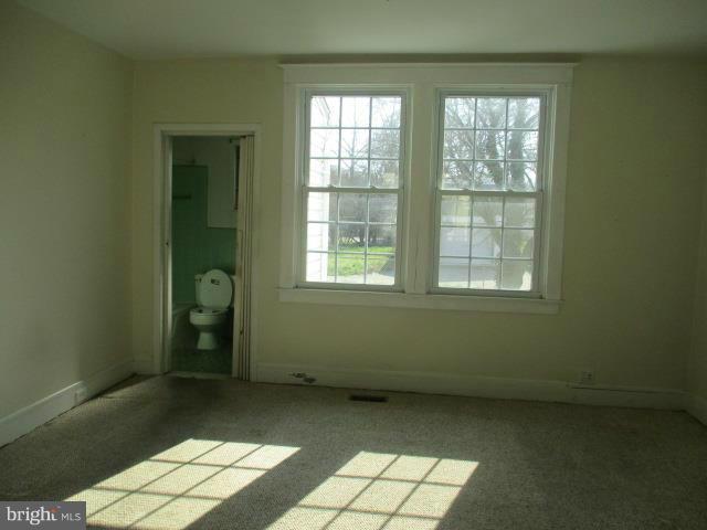 39 Township Road Baltimore, MD 21222 - Photo 8 of 24 an empty room with windows
