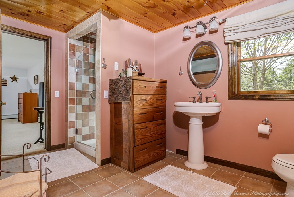 65 Colony Road Phillipston, MA 01331 - Photo 18 of 26 a bathroom with a sink a mirror and a toilet