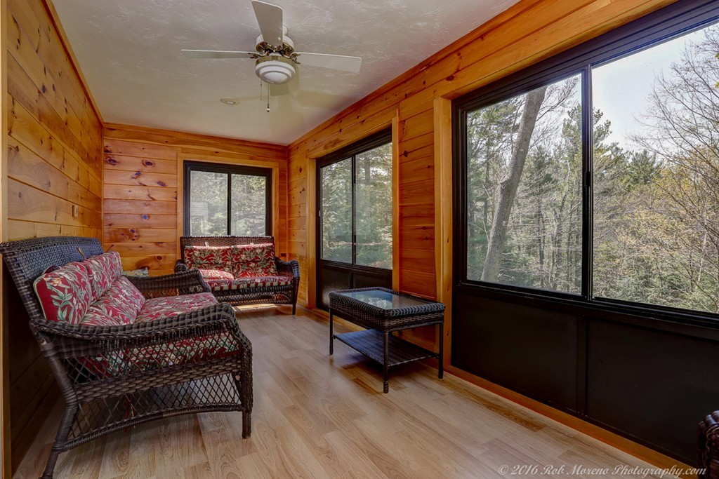 65 Colony Road Phillipston, MA 01331 - Photo 20 of 26 a living room with furniture and a floor to ceiling window