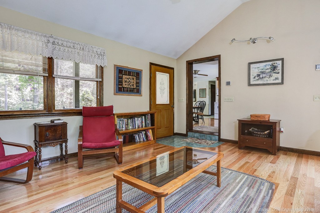 65 Colony Road Phillipston, MA 01331 - Photo 9 of 26 a living room with furniture a wooden floor and a large window