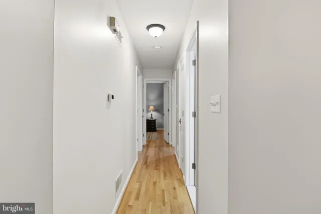 a bathroom with a sink toilet and a mirror