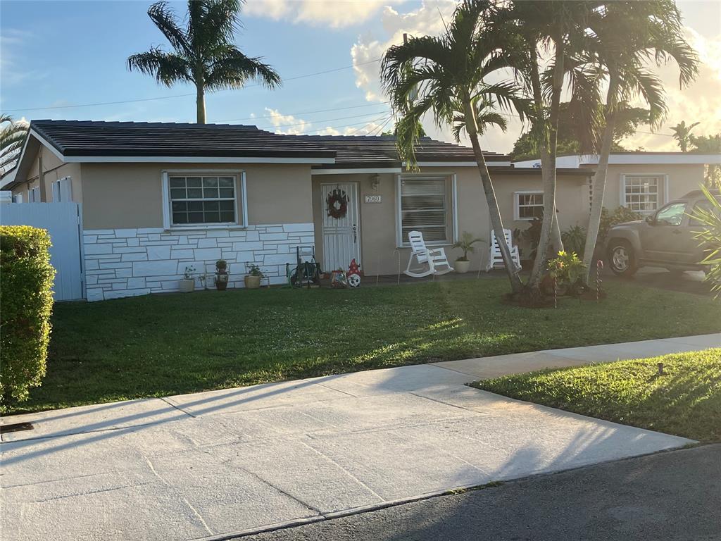 7960 Northwest 174th Street Hialeah, FL 33015 - Photo 1 of 20 front view of a house with a garden