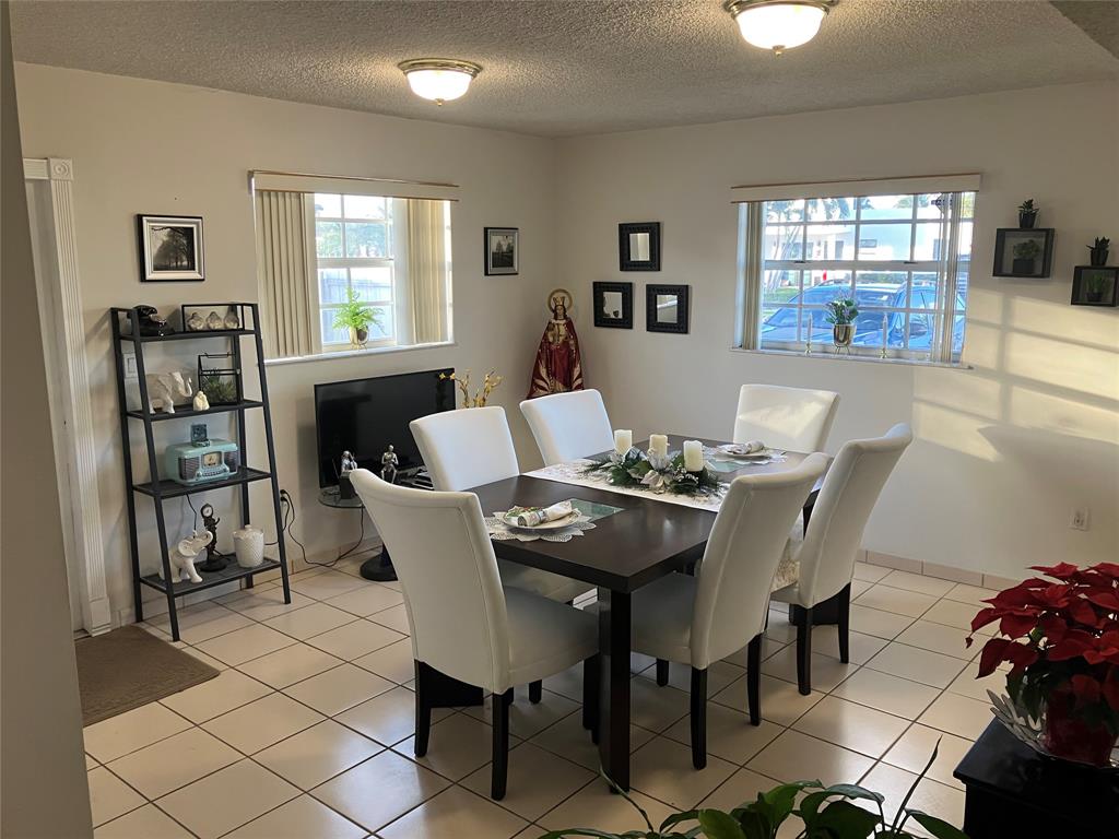 7960 Northwest 174th Street Hialeah, FL 33015 - Photo 16 of 20 a view of a dining room with furniture and window