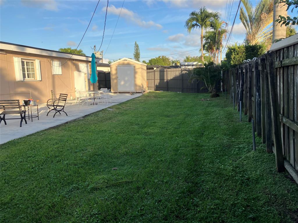 7960 Northwest 174th Street Hialeah, FL 33015 - Photo 20 of 20 a view of a house with backyard and porch